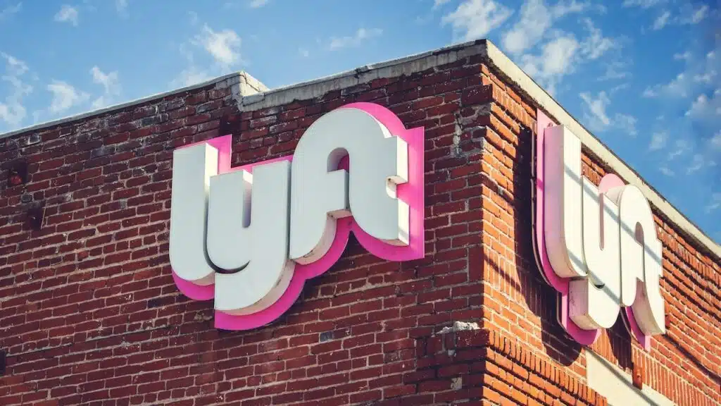 A view of a building front sign for one of the Lyft branches.