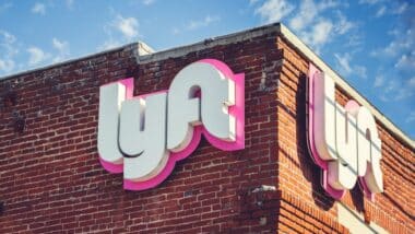 A view of a building front sign for one of the Lyft branches.