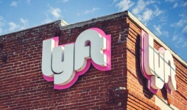 A view of a building front sign for one of the Lyft branches.