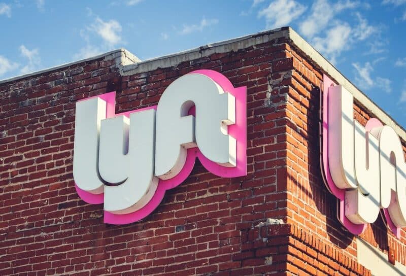 A view of a building front sign for one of the Lyft branches.