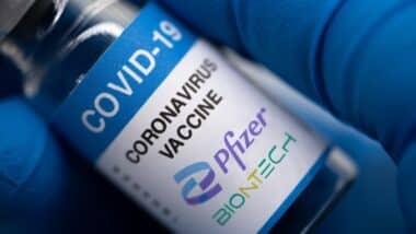 Covid-19 vaccine with Pfizer logo.