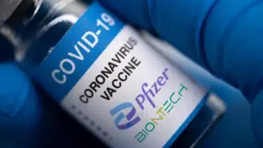 Covid-19 vaccine with Pfizer logo.