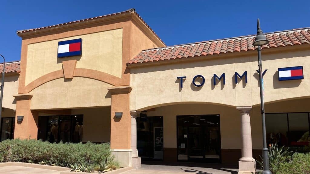 Tommy Hilfiger sign, logo on the store facade at Desert Hills Premium Outlets mall - Cabazon, California, USA