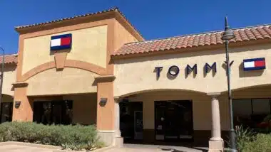 Tommy Hilfiger sign, logo on the store facade at Desert Hills Premium Outlets mall - Cabazon, California, USA