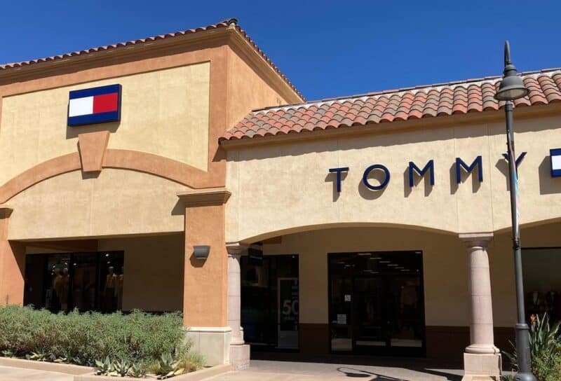 Tommy Hilfiger sign, logo on the store facade at Desert Hills Premium Outlets mall - Cabazon, California, USA
