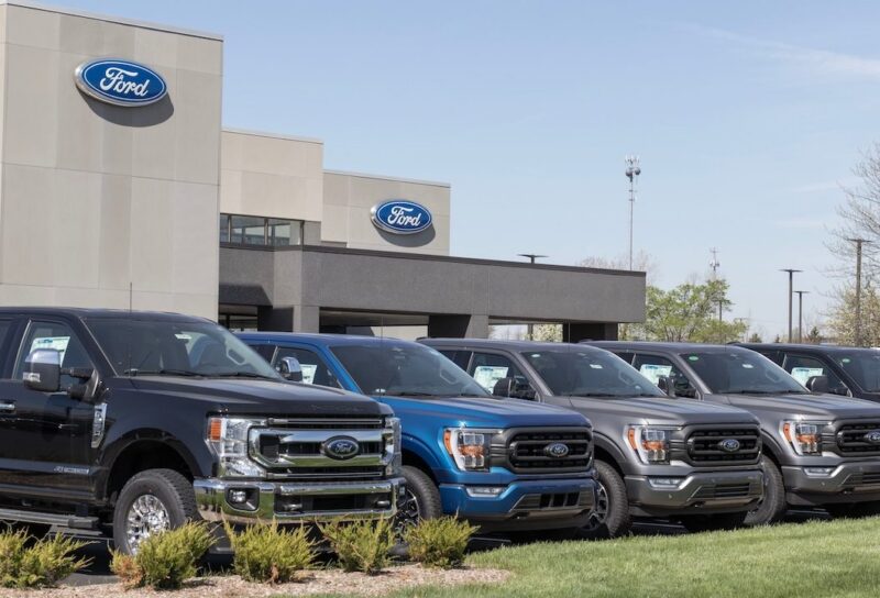 Ford F-250 and F-150 display at a dealership.