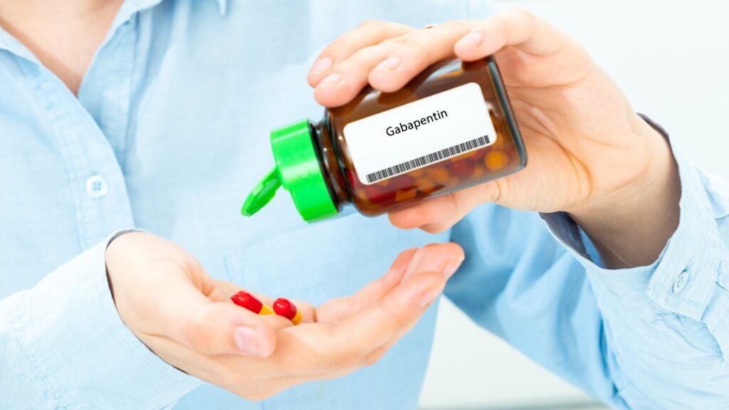 Gabapentin Woman Hand holding on open palm with pill tablets medicine for healing