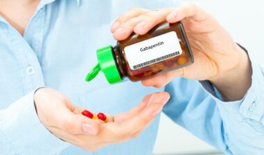 Gabapentin Woman Hand holding on open palm with pill tablets medicine for healing