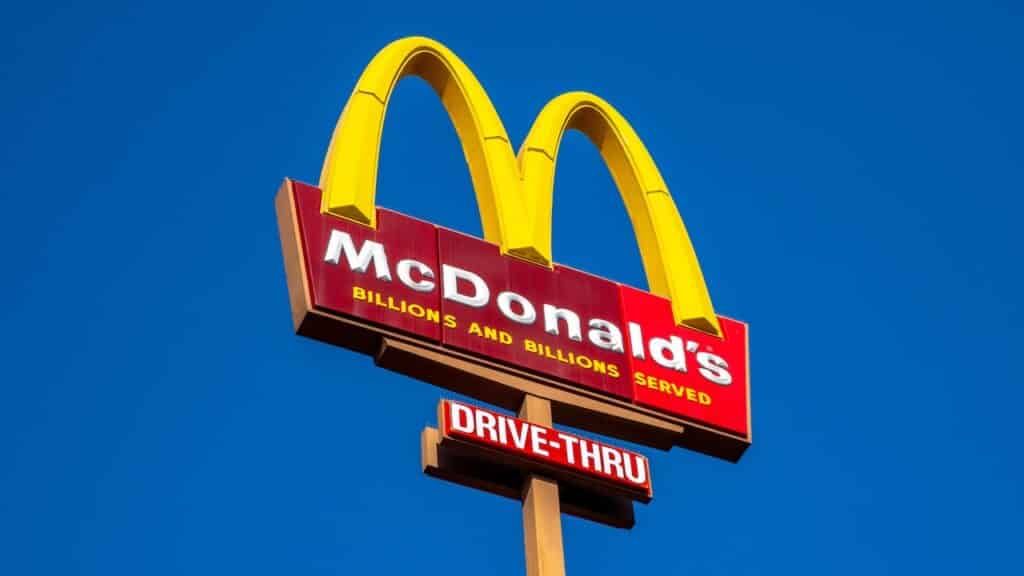 McDonald's burger fast food restaurant. Sign, logo, angle view