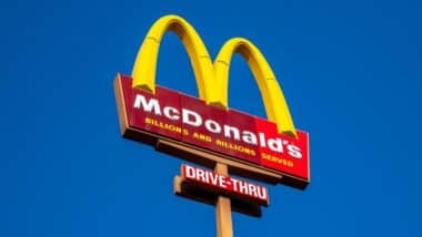 McDonald's burger fast food restaurant. Sign, logo, angle view