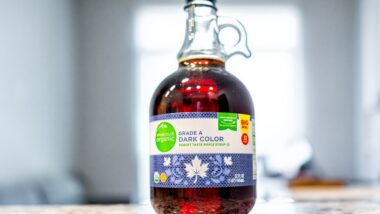 Closeup macro of Kroger brand organic maple syrup sign text label as grade A dark color product