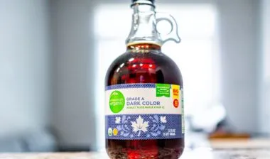 Closeup macro of Kroger brand organic maple syrup sign text label as grade A dark color product