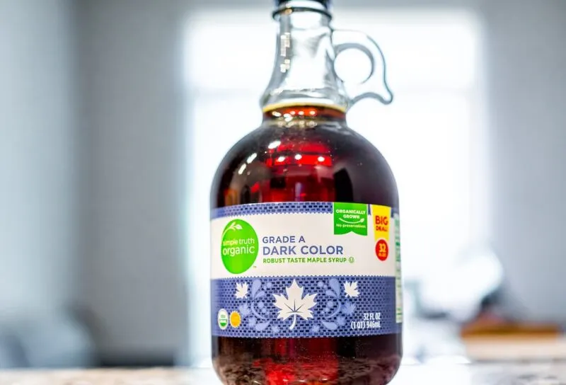 Closeup macro of Kroger brand organic maple syrup sign text label as grade A dark color product