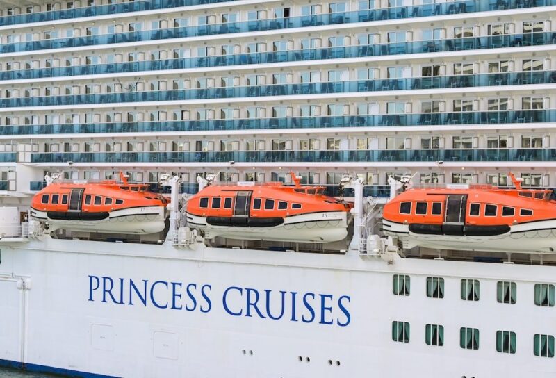 Side view of the cruise ship Sky Princess and lifeboats with the logo of Princess Cruises on its hull.