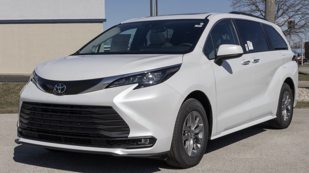 Toyota Sienna XLE SUV Minivan display at a dealership. Toyota offers the Sienna with a 2.5L 4-Cylinder Hybrid engine. MY:2026