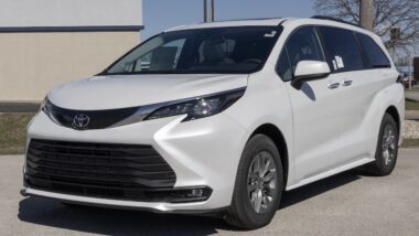 Toyota Sienna XLE SUV Minivan display at a dealership. Toyota offers the Sienna with a 2.5L 4-Cylinder Hybrid engine. MY:2026