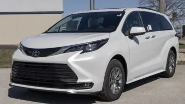 Toyota Sienna XLE SUV Minivan display at a dealership. Toyota offers the Sienna with a 2.5L 4-Cylinder Hybrid engine. MY:2026