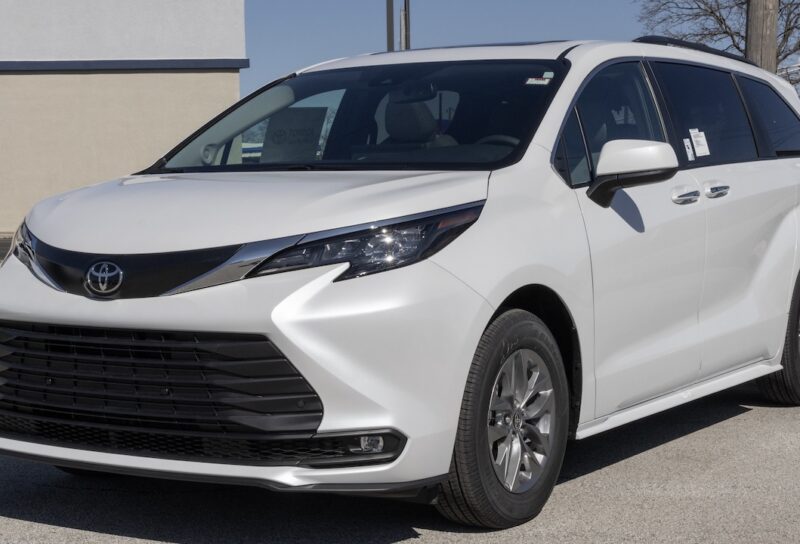 Toyota Sienna XLE SUV Minivan display at a dealership. Toyota offers the Sienna with a 2.5L 4-Cylinder Hybrid engine. MY:2026