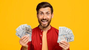 Happy Man Holding Cash With Big Smile
